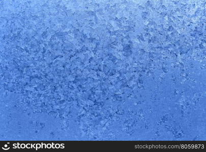 Texture of natural ice pattern on winter glass