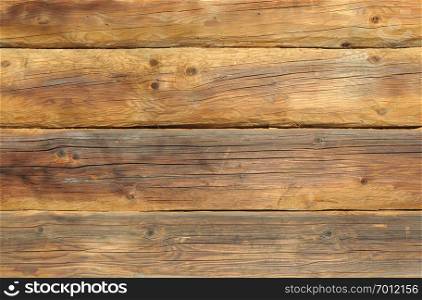 Texture of natural wooden wall of old brown logs