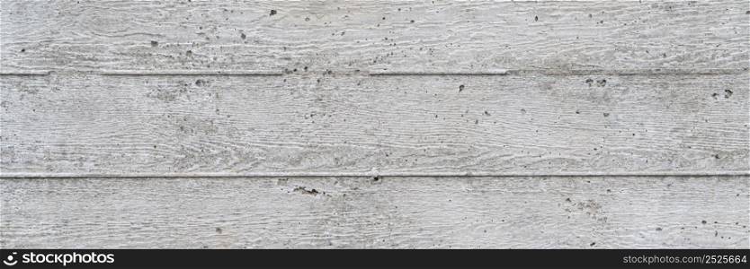 texture of new gray grunge concrete wall with embedded grain and pattern of wooden planks for background, panoramic web banner