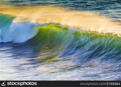 Texture of Ocean wave at sunset time.