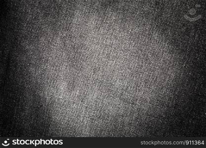 Texture of old black jeans for background
