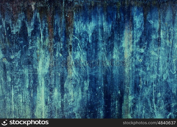 Texture of old concrete wall painted in blue paint closeup