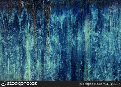 Texture of old concrete wall painted in blue paint closeup