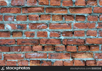 Texture of old damaged red brick wall