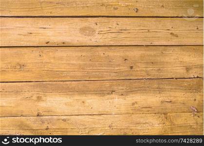 Texture of old ginger wooden fence