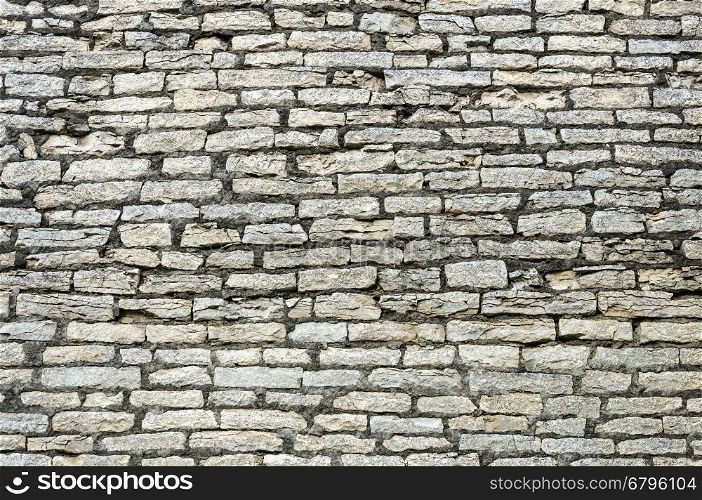 Texture of old gray stone wall