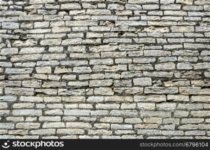 Texture of old gray stone wall