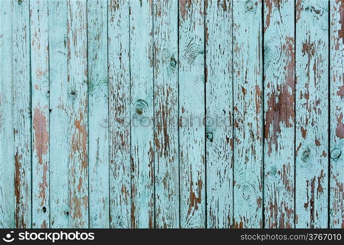 Texture of old green wooden planked fence