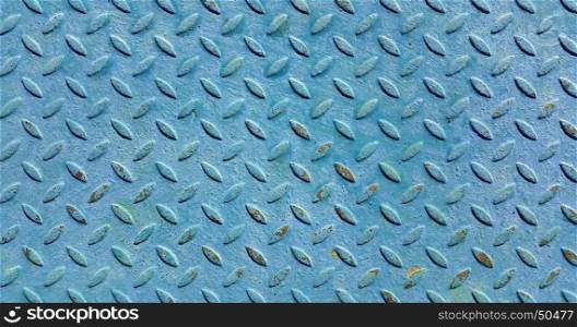 Texture of old metal diamond plate covered with blue paint