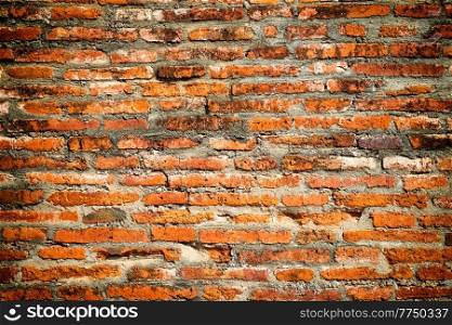 Texture of old red and brown brick wall as vintage background