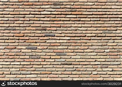 Texture of old vintage flat brick wall in Tbilisi, Georgia. Old brown brick wall background