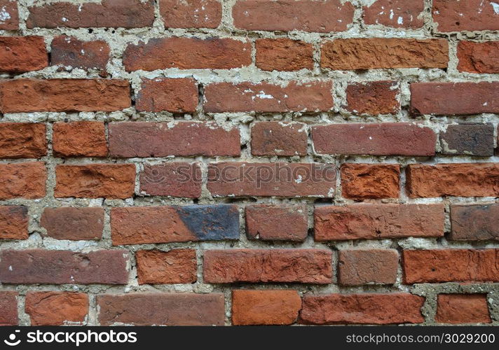 Texture of old weathered red brick wall surface. Old weathered red brick wall texture