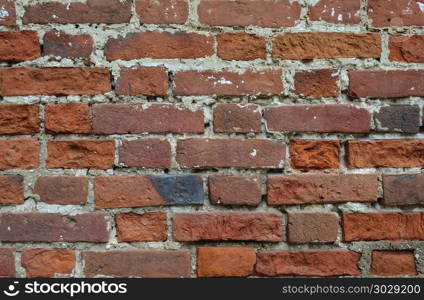 Texture of old weathered red brick wall surface. Old weathered red brick wall texture