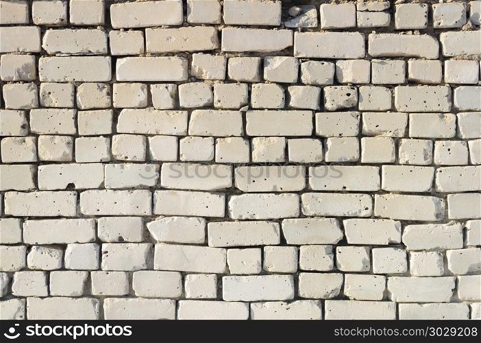 Texture of old weathered white brick wall. Old white brick wall background