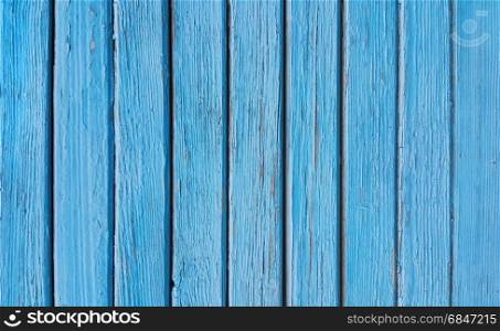Texture of old wooden blue fence close-up. Texture of old wooden blue fence