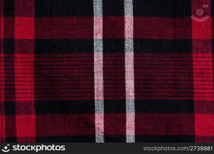Texture of red-black checkered fabric pattern background