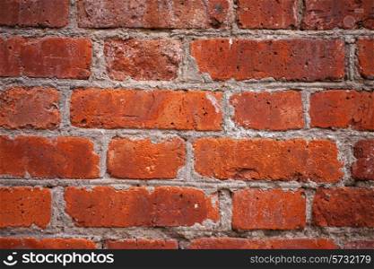 Texture of red brick wall close up