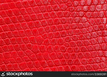 Texture of red leatherette closeup. Repeating pattern.