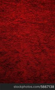 Texture of red terry towel close up