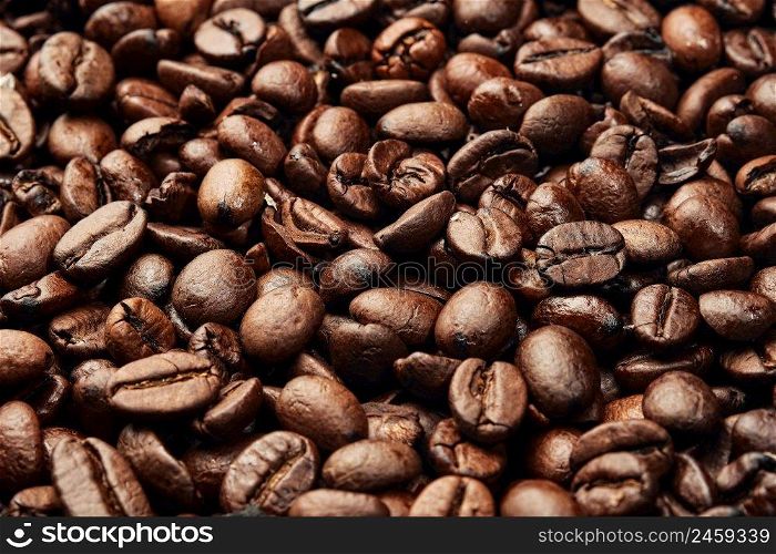 Texture of roasted ready to drink coffee. Close-up, selective focus. Scene of coffee beans. Black ground coffee