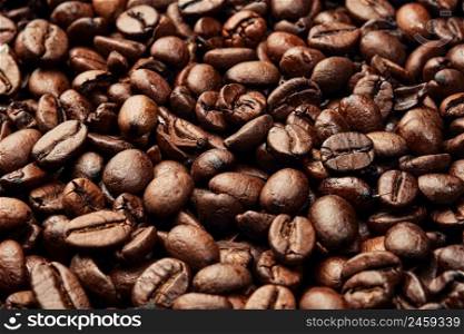 Texture of roasted ready to drink coffee. Close-up, selective focus. Scene of coffee beans. Black ground coffee