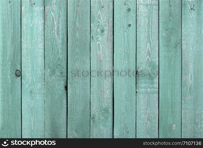 Texture of rough green painted wooden fence background