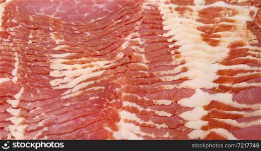 texture of sliced raw bacon, full frame, close up