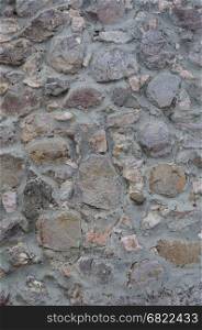 Texture of smooth gray stone wall surface
