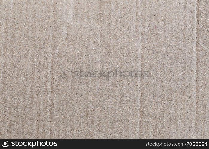 Texture of the brown paper box or cardboard for the design background.