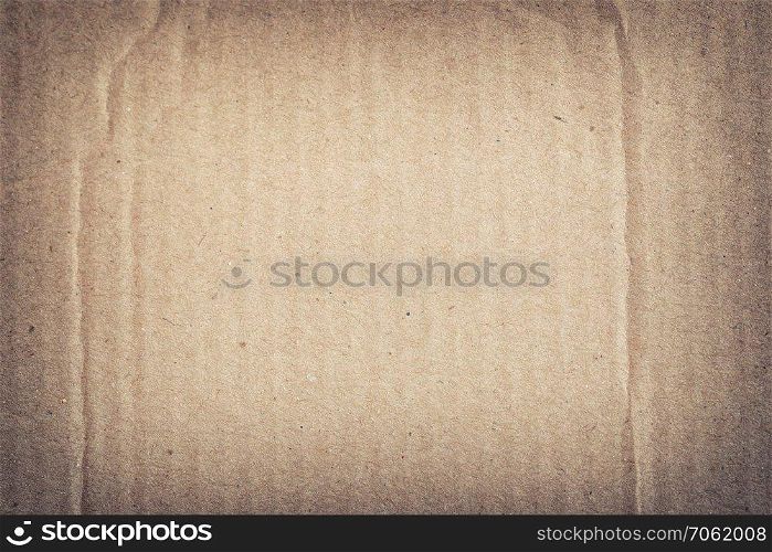 Texture of the brown paper box or cardboard in vintage style for the design background.