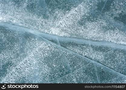 Texture of the ice, cracks. Lake Baikal, Russia