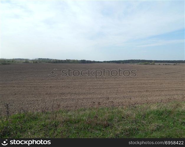 Texture of the land plowed by a plow field