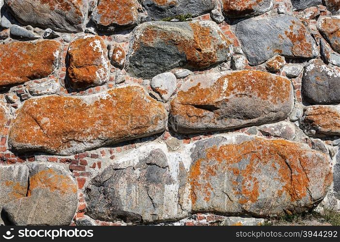 Texture of the walls of large rusty boulders in Solovetsky monastery