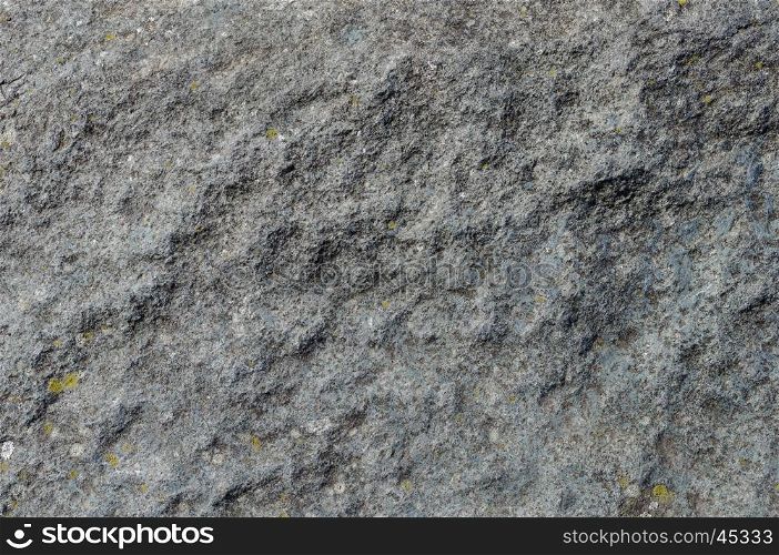 Texture of uneven grey rock surface