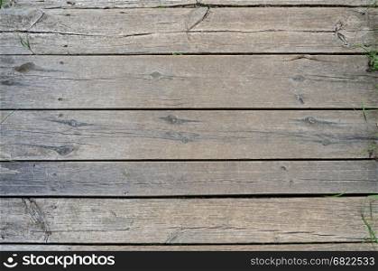Texture of unpainted natural wooden boards pavement