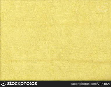 Texture of yellow microfiber cloth for design background.