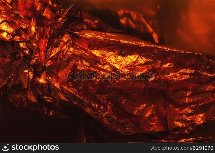 texture orange crumpled foil in closeup