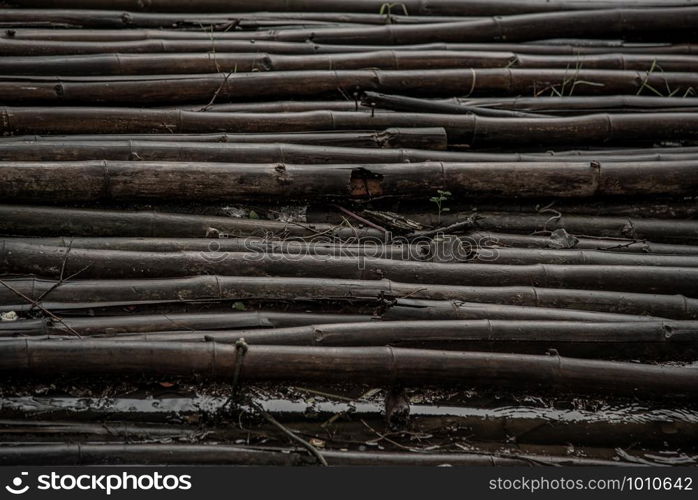 Texture pattern of Old bamboo raft at the swamps. A way to travel by water. copy space.