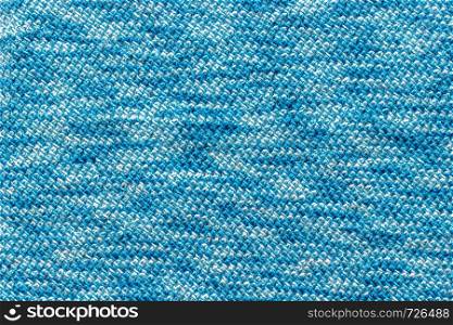 Texture patterned knit fabric. Knitting yarn handmade.. Texture fabric tied with blue yarn.