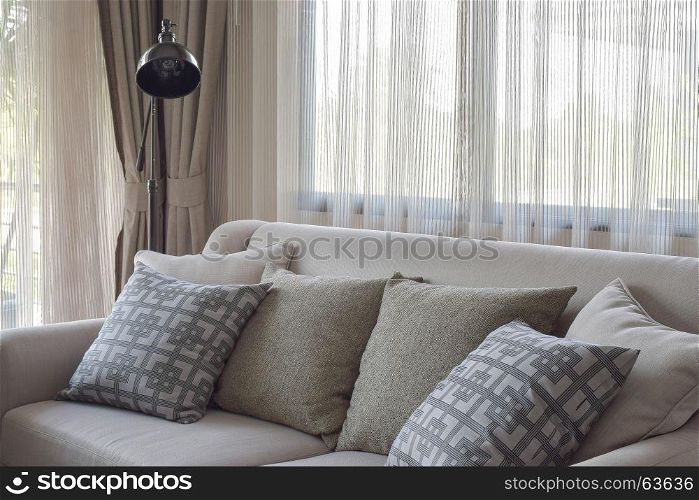 Texture pillows on beige sofa in modern living room