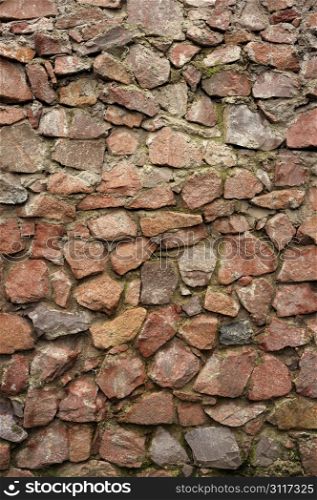 texture - the wall of the round rough stones