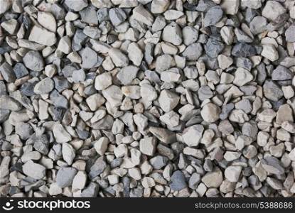 Textured background of pale crushed stone