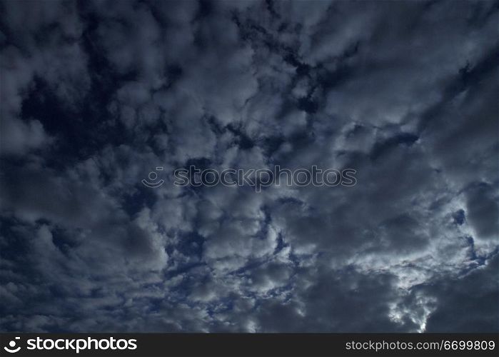 Textured Clouds In A Dark Sky