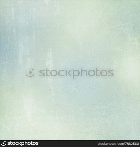 Textured paper background in green, beige and blue