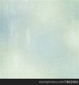Textured paper background in green, beige and blue