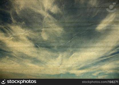 textured paper box of clouds on blue sky for vintage background.