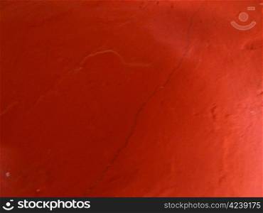 textured red surface with a crack detail