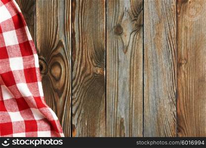 Textured vintage rustic wooden background with red tablecloth