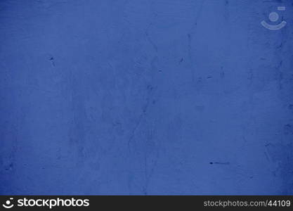 Textures on the blue wall, for background. Grungy blue concrete wall background. Background from high detailed fragment stone wall. Cement texture. Blue concrete wall.