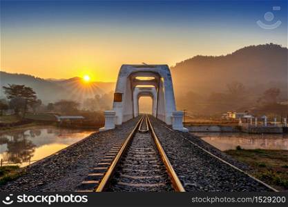 Thachomphu Railway Bridge or White Bridge at sunrise in Lamphun, Thailand.